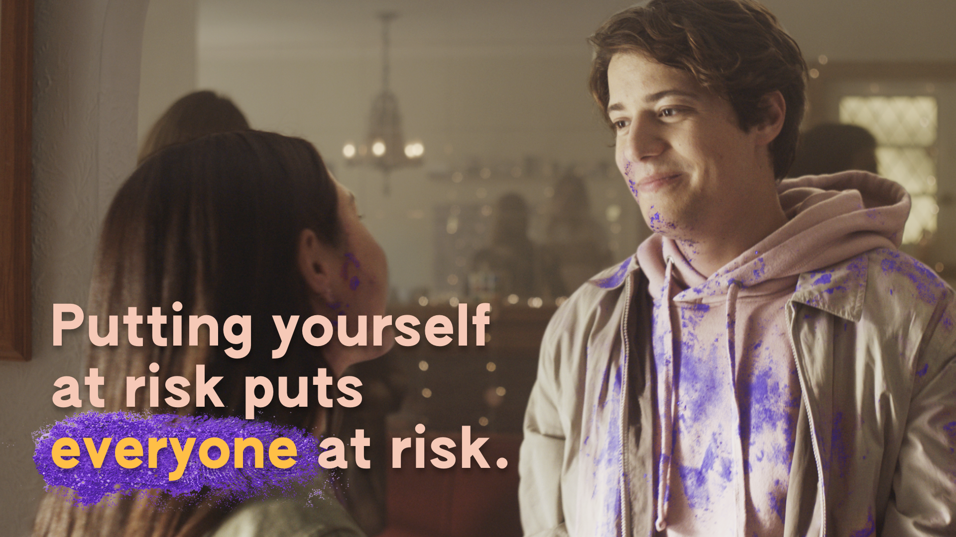 Billboard Billboard image of two teens covered in purple sparkles talking at a party.