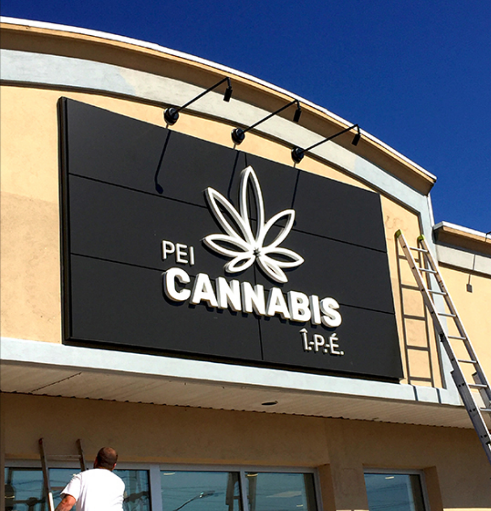 PEI-Cannabis-Store-2 PEI Cannabis logo signage being installed on exterior of building.