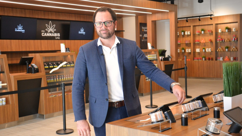 PEI-Cannabis-staff-03 PEI Cannabis president, Zach Currie, standing in PEI Cannabis store during grand opening.