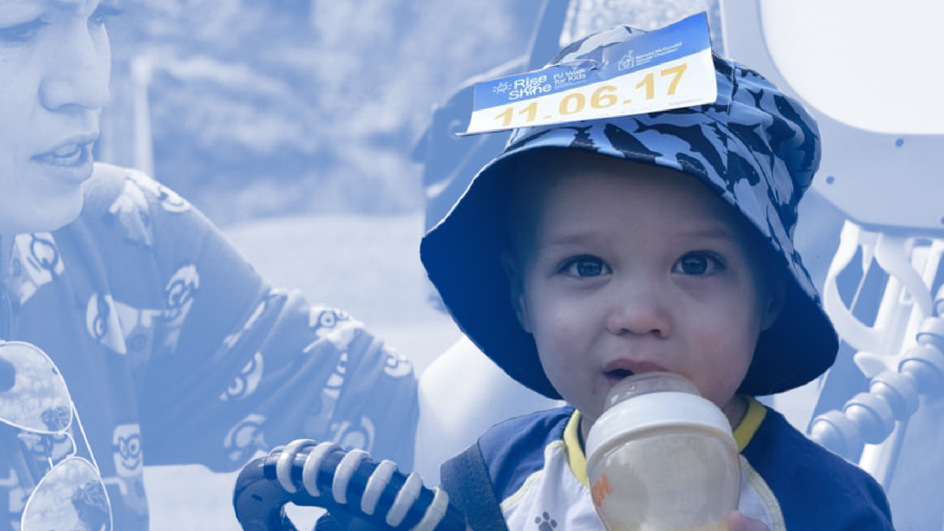 RMHCA-PJ-Walk-for-Kids-1 Baby wearing bucket hat with racing bib on top.